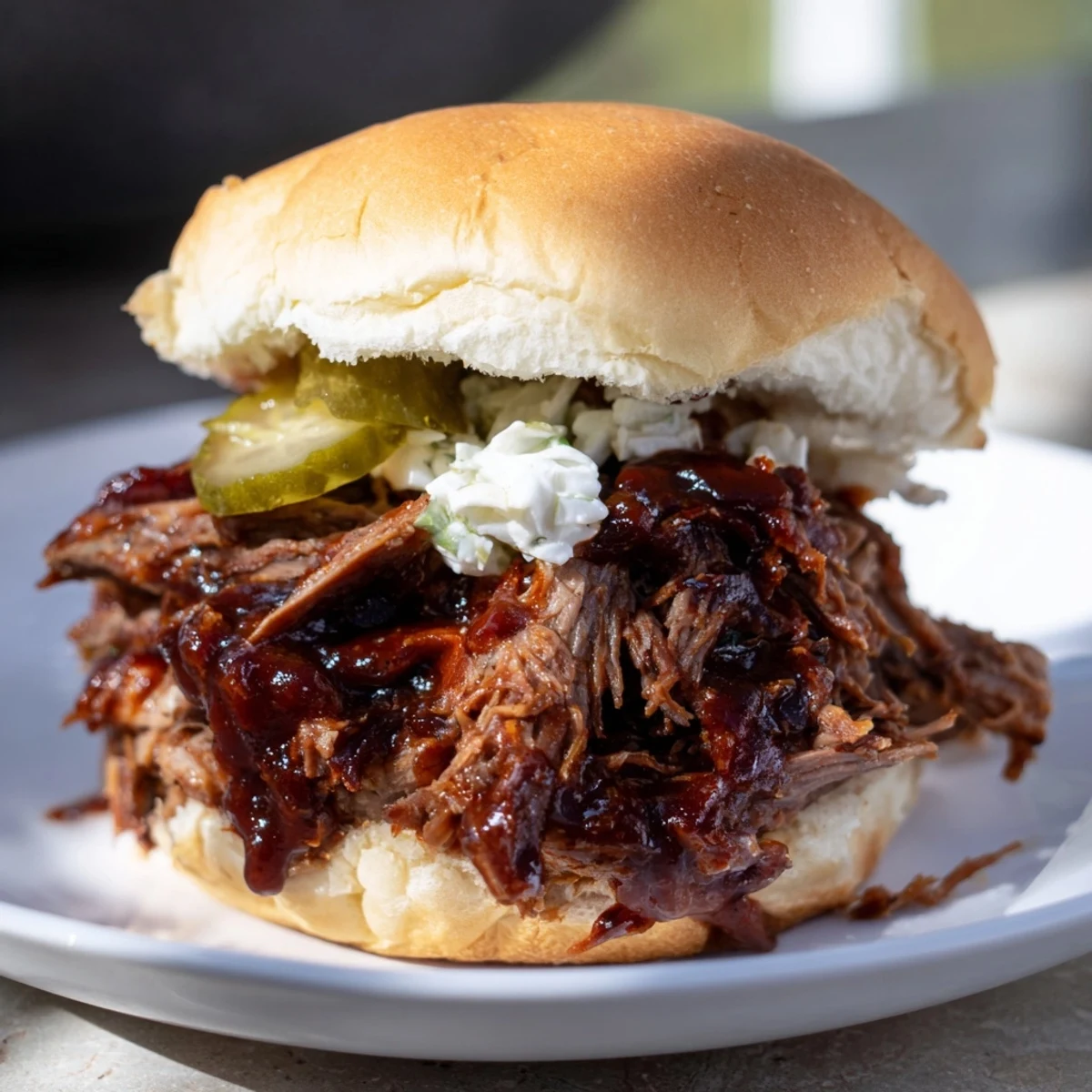 Beef Brisket Sliders served warm from the oven, featuring juicy shredded brisket, tangy sauce, and crisp pickles on buttery buns for gatherings.