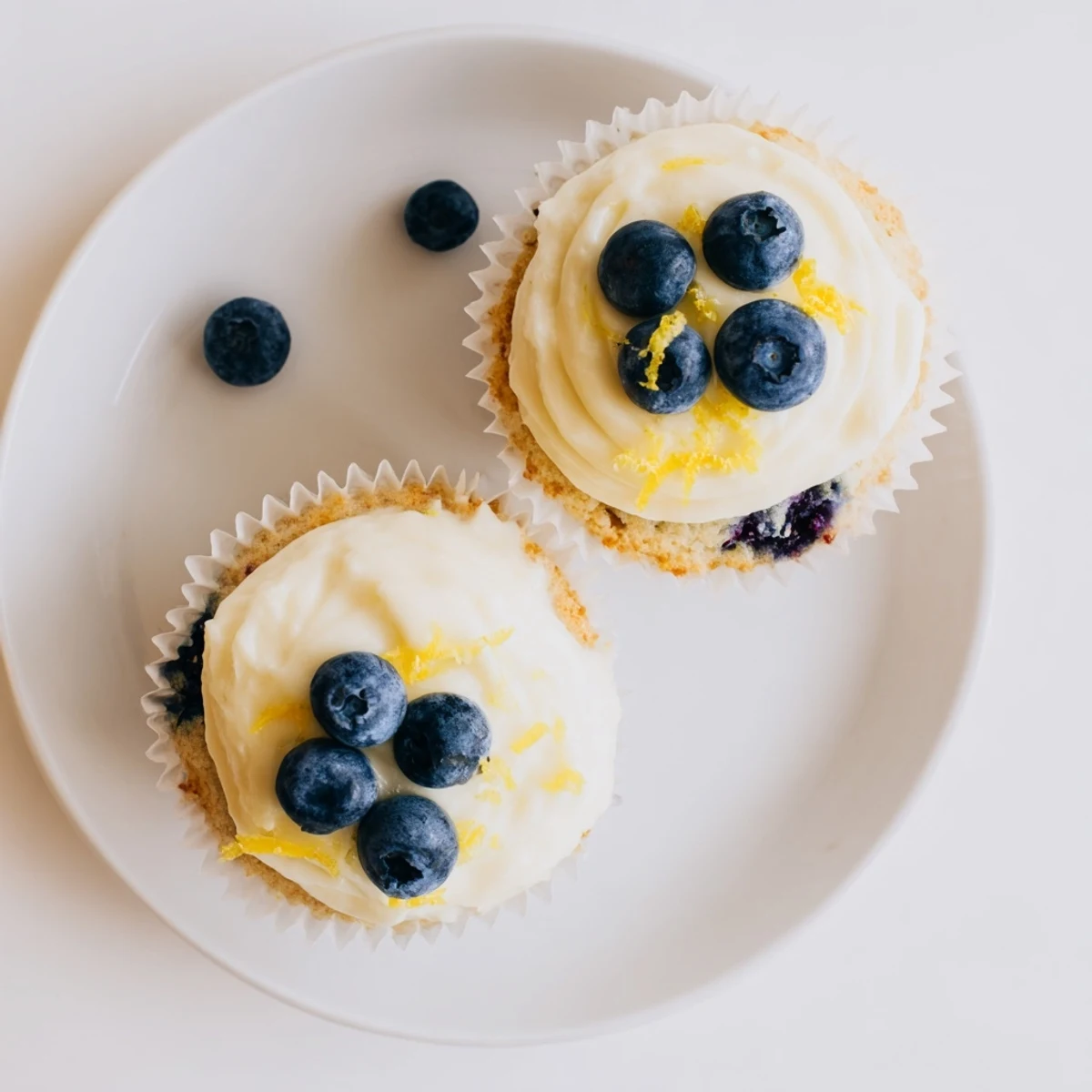 Light and fluffy lemon blueberry cupcakes with zesty citrus flavor and tangy cream cheese frosting