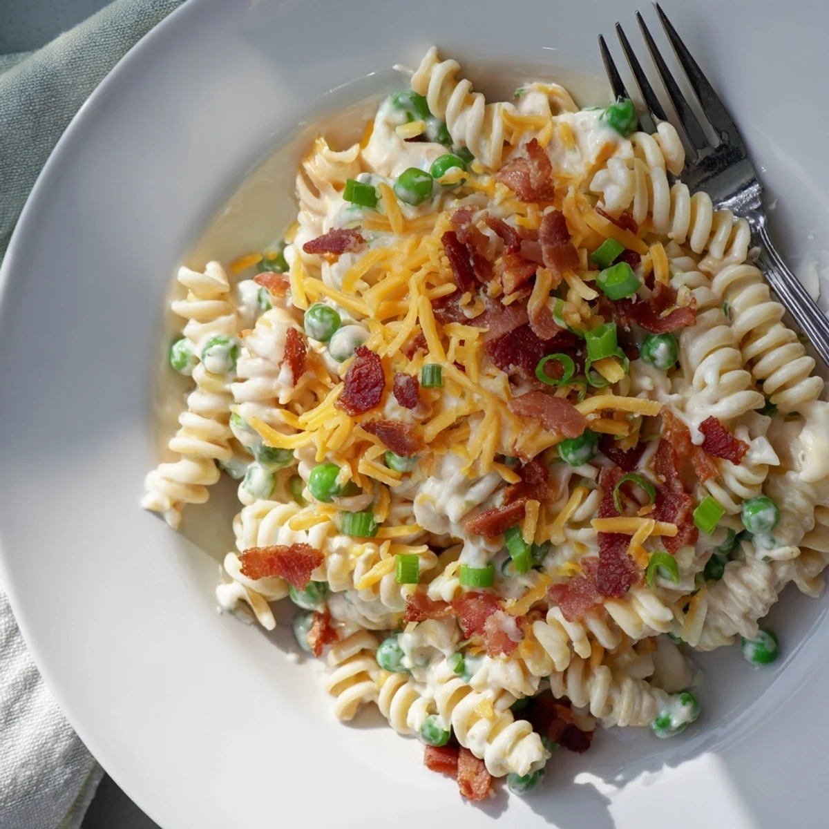 Creamy crack pasta salad loaded with crispy bacon, sharp cheddar, and green onions in a rich ranch dressing