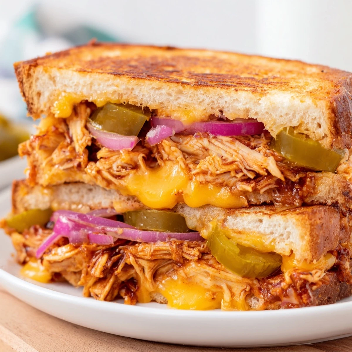 Savory BBQ chicken stuffed grilled cheese featuring crispy toasted sourdough and gooey layered cheese