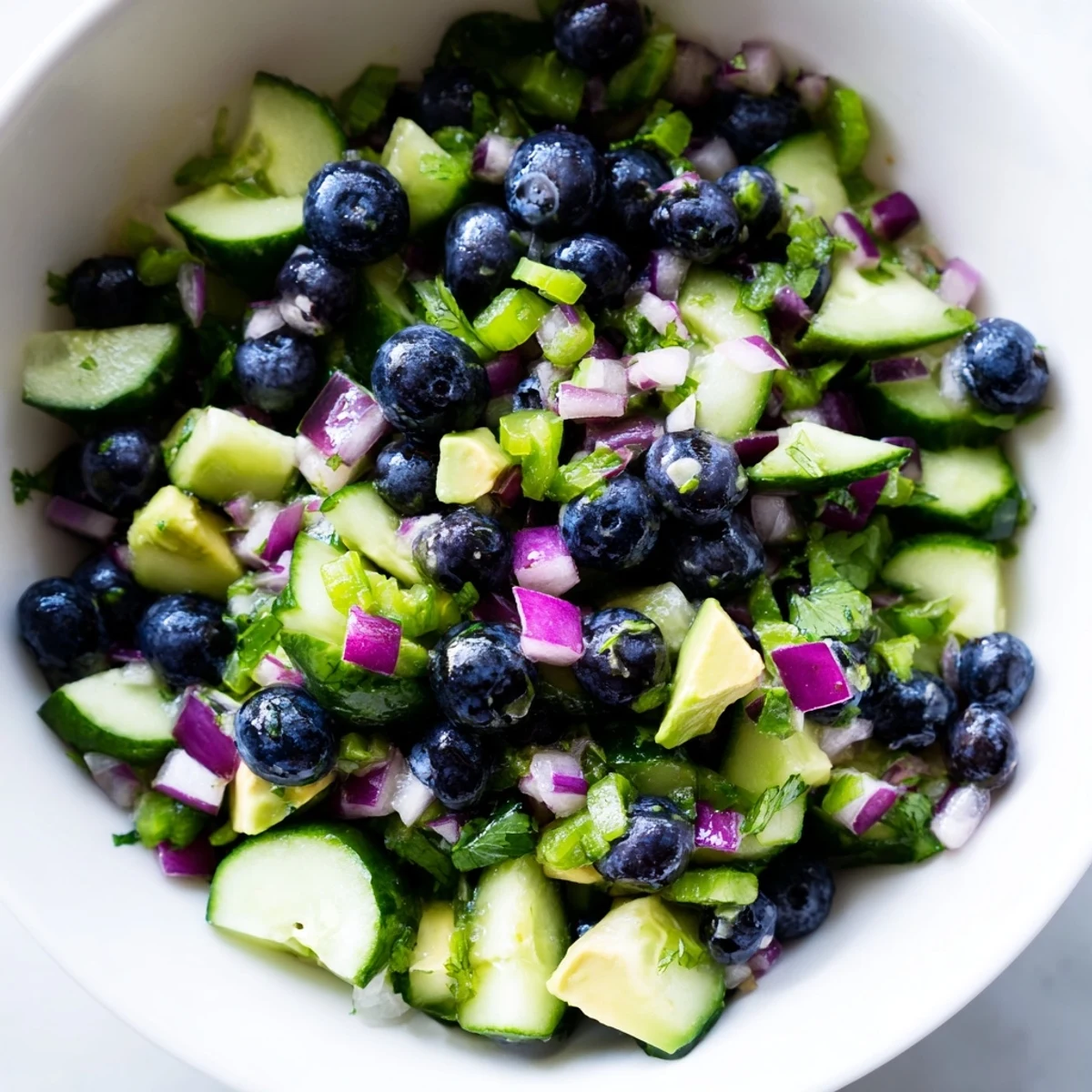 Bright blueberries and crisp diced cucumber tossed with cilantro and lime in this refreshing salsa